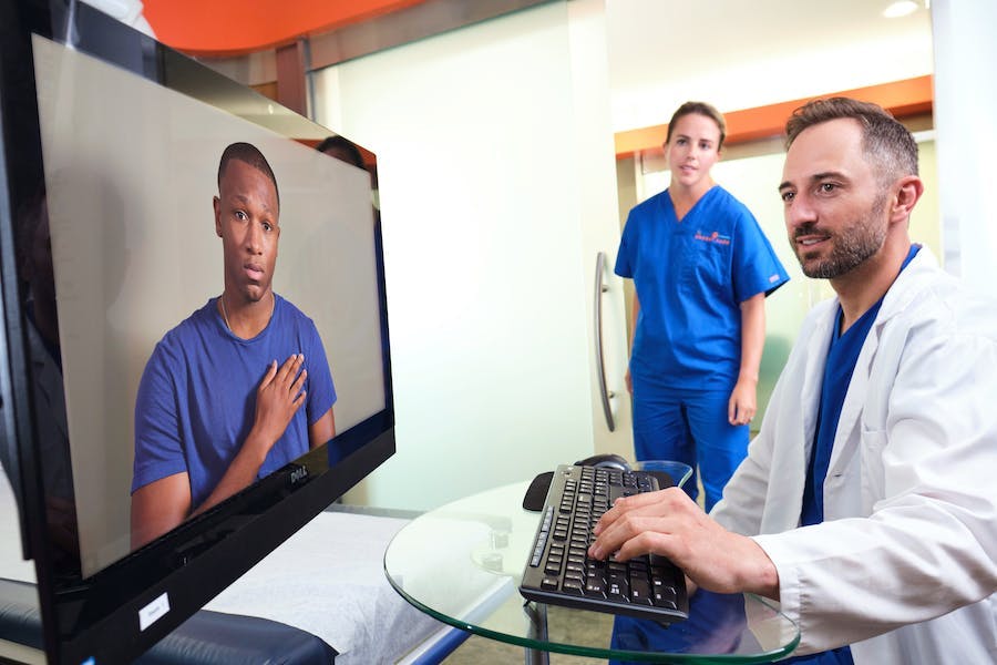 Provider and nurse meet virtually with a patient