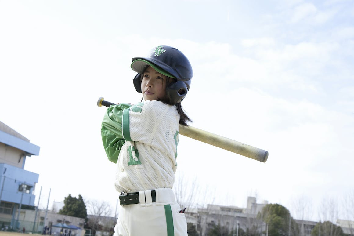 Little girl playing baseball